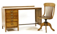 Lot 544 - An early 20th century oak desk
