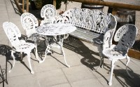 Lot 558 - An aluminium 'lilly of the valley' garden seat