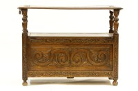 Lot 519 - A 1920s oak monk's bench