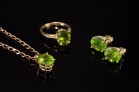 Lot 577 - A gold and peridot pendant