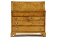 Lot 437 - A reproduction oak bureau