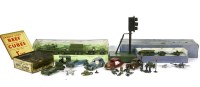 Lot 235 - Die-cast toys: two boxed army sets (poor condition); three saloons