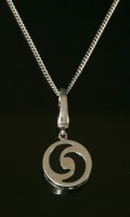 Lot 424 - An 18ct white gold and onyx 'Optical' pendant/charm by Bulgari
