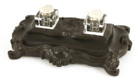 Lot 117 - A French ebony desk stand