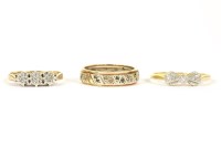 Lot 35 - A 9ct gold three stone illusion set ring