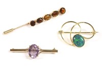 Lot 10 - A gold single stone oval cut amethyst bar brooch
