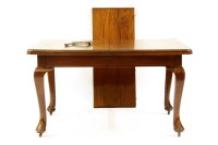 Lot 546 - An Edwardian mahogany extending dining table