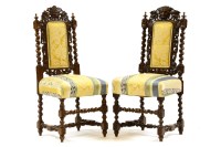 Lot 540 - A pair of Carolean design oak side chairs