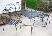 Lot 554 - A French wrought iron garden suite