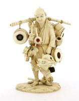 Lot 477 - A Japanese ivory okimono