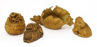 Lot 556 - A collection of four palm wood carvings