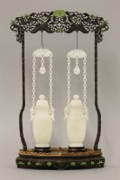 Lot 200 - A pair of Chinese jade vases and covers