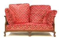Lot 440 - A Regency style bergere settee