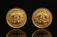 Lot 528 - A pair of Chanel gold-plated double 'C' circular clip-on earrings