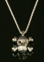 Lot 350 - A white gold Christian Dior 'Tete De Mort' diamond skull pendant