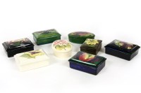 Lot 404 - Eight Moorcroft table pots and covers