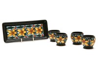 Lot 314 - A Moorcroft 'Tiffany' pattern egg cups