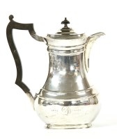 Lot 237 - A silver chocolate pot of rounded rectangular form