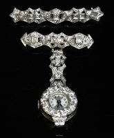Lot 130 - A platinum and diamond set Swiss mechanical fob watch and bar brooch