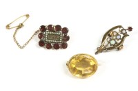 Lot 125 - A gold single stone oval cut citrine brooch