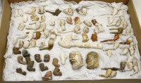 Lot 427 - A collection of approximately seventy five vintage clay pipe bowls
