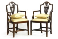 Lot 560 - A pair of 19th century Hepplewhite design mahogany elbow chairs