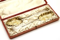 Lot 188 - A cased pair of Victorian silver berry spoons