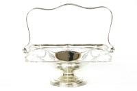 Lot 132 - An Edwardian silver swing handled fruit basket of scalloped outline