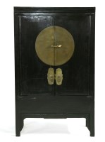 Lot 544 - A Chinese hardwood two door cabinet