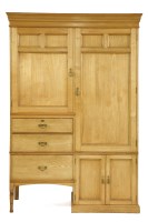Lot 618 - An Edwardian light oak compactum