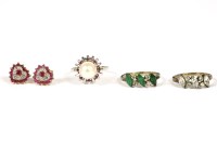 Lot 64 - A pair of 9ct gold ruby and diamond heart shaped cluster stud earrings