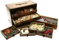 Lot 57A - A cabinet of drawers with ivory and ethnographic jewellery and bits