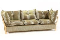 Lot 581 - A modern Danish three seater settee