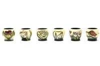 Lot 397 - A Moorcroft set of six 'Springtime' egg cups