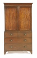 Lot 792 - A George III mahogany press cupboard
