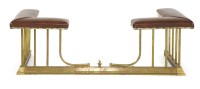 Lot 717 - A brass and leather upholstered and adjustable club fender