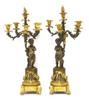 Lot 749 - A pair of bronze and ormolu five-light candelabra