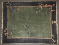 Lot 496 - A blue ground oriental style carpet
