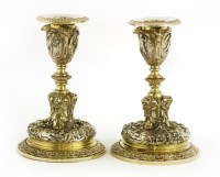 Lot 154 - A pair of Elkington parcel-gilt and electroplate dwarf candlesticks