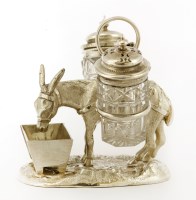 Lot 82 - Two electroplated donkey cruets