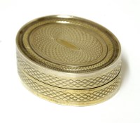Lot 8 - A George III oval silver gilt and engine-turned vinaigrette