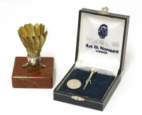 Lot 38 - Badminton interest:  a silver model of a shuttlecock