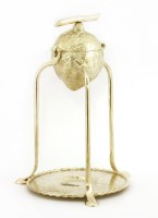 Lot 28 - A silver-plated lemon squeezer