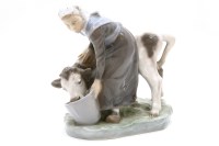 Lot 196 - A Royal Copenhagen milk maid and calf