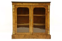 Lot 554 - A Victorian inlaid walnut display cabinet