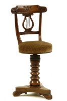 Lot 657 - A 19th century revolving piano stool