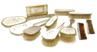 Lot 111 - A silver and enamel three piece dressing table set