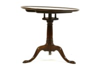 Lot 595 - A Georgian mahogany dish top birdcage tripod table