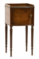 Lot 596 - A Georgian mahogany bow front bedside cupboard
