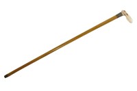 Lot 483 - A carved ivory handled cane